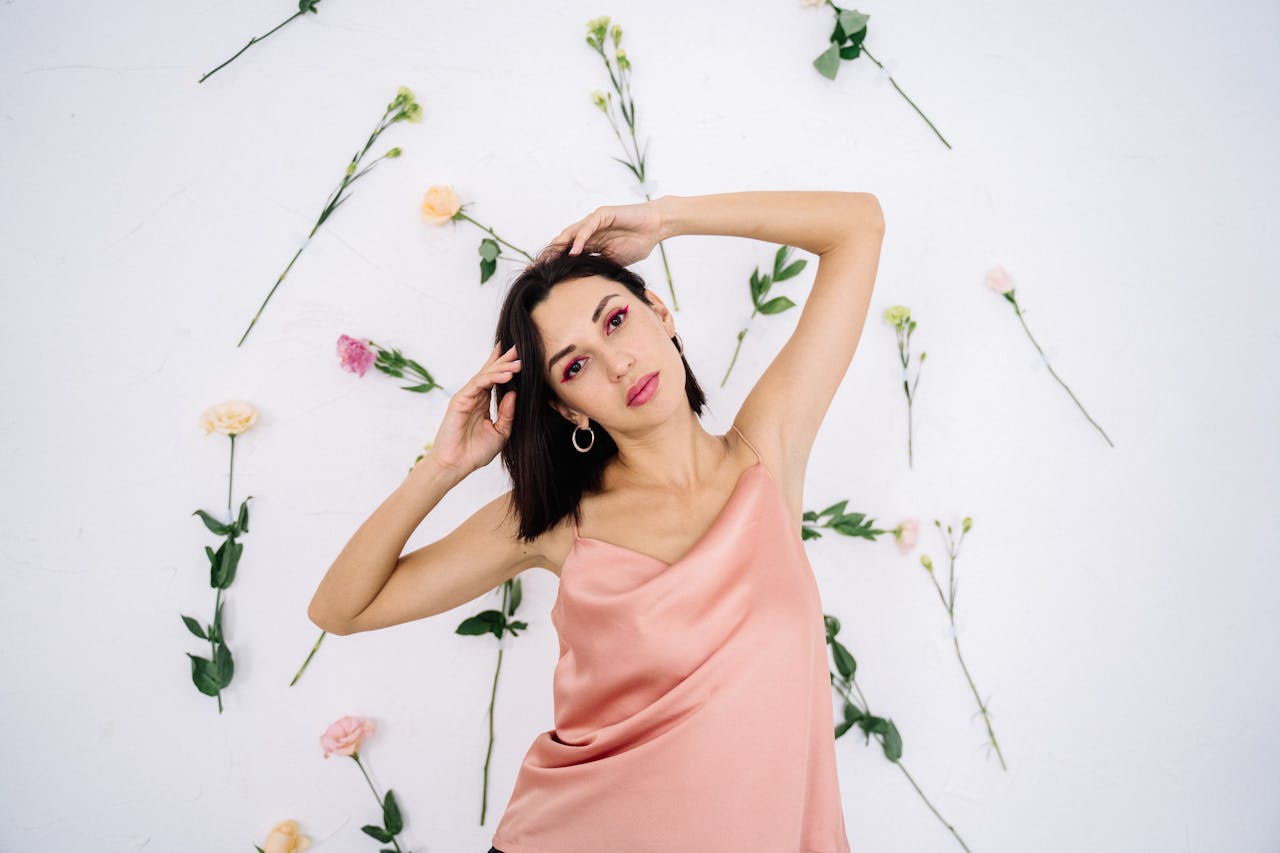 A happy couple smiling and enjoying a romantic moment together outdoors during the day.